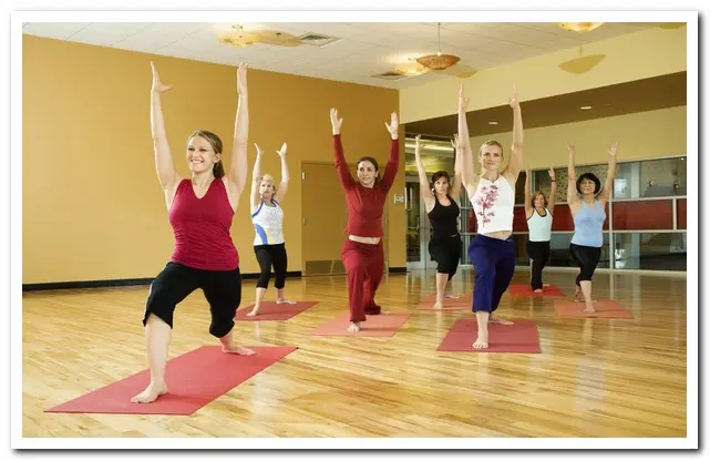 Women doing yoga together at an all female treatment center for addiction 