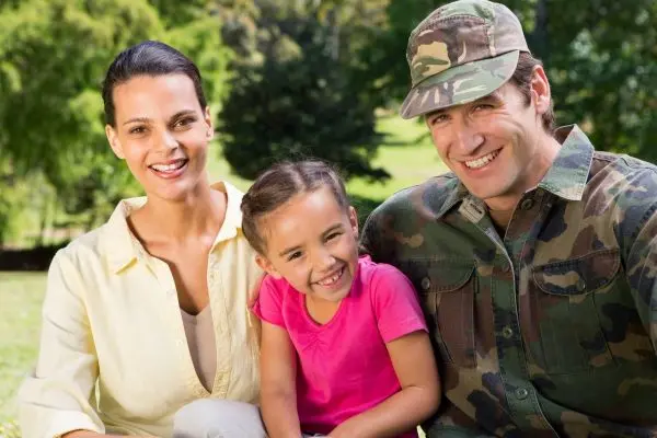 Happy military family after the military father went to treatment for addiction and ptsd at a Veterans drug rehab.